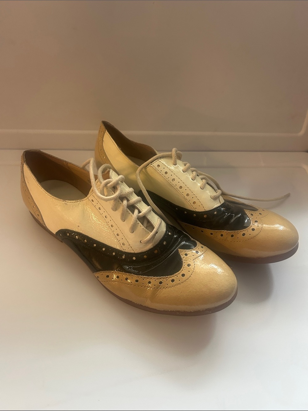 Born Two-Tone Wingtip Oxfords in Cream, Black & Tan